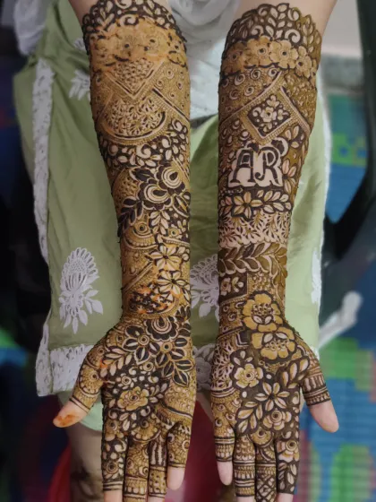 Your story, told in henna. I specialize in personalizing your bridal mehndi, like weaving you and your partner's initials seamlessly into the floral and geometric patterns.