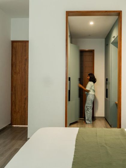 Cleverly designed storage solutions are integrated into the bedroom, maintaining a clutter-free and minimal spatial experience.