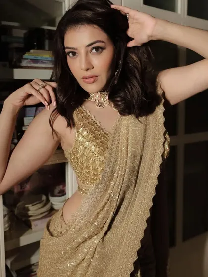 A more candid shot of Kajal Aggarwal's festive hairstyle. The waves are designed to look natural and effortless, adding to her radiant charm.