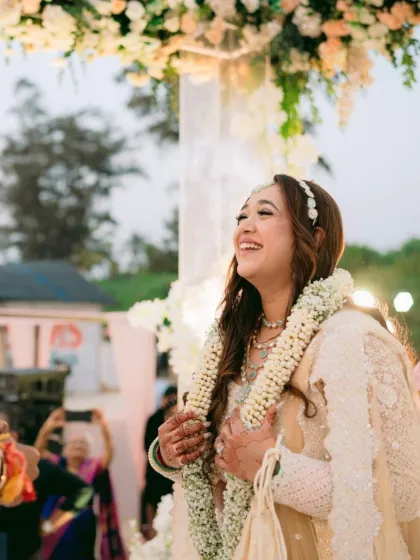 Pure happiness captured at a Goa wedding. The bride's makeup is radiant and natural, designed to withstand the sea breeze while looking effortlessly beautiful.