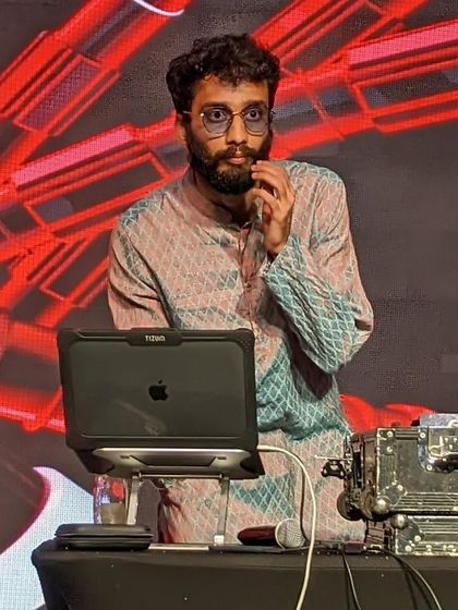 A candid shot while speaking on the mic during the corporate gig.