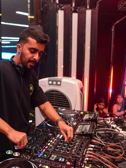 A close-up of me working the mixer at Flo, ensuring every element of the sound is perfect.