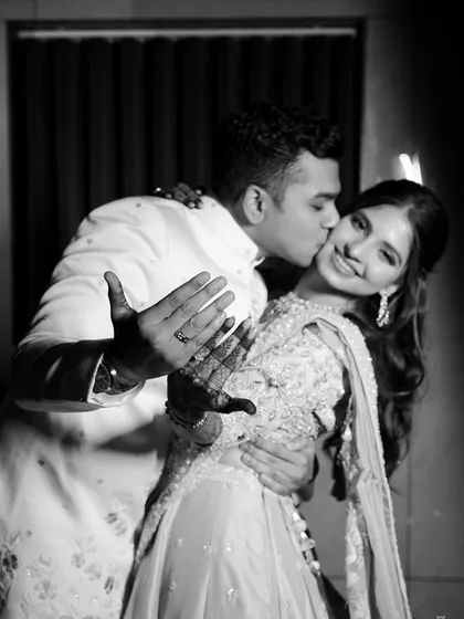 A classic black and white shot capturing a sweet moment. The makeup was structured to look beautiful in all forms of photography, with defined eyes and a radiant smile being the focus.