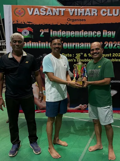 A runner-up from the B Group Men's Doubles receiving his award.