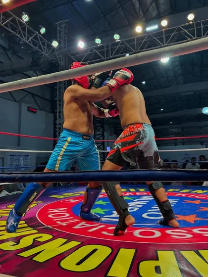 A gritty, close-up shot of the intensity inside the ring. This is what it takes to be a champion.