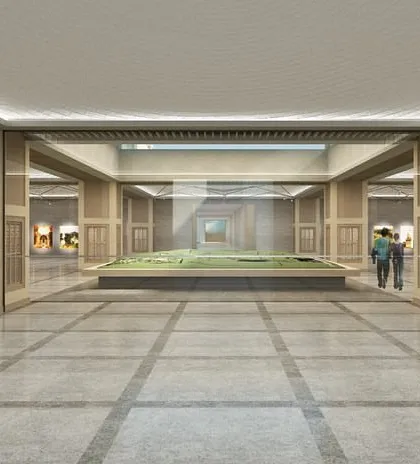 A view towards a central model display at the Qutub-Shahi Centre. The layout is organized with a clear sense of order, guiding visitors through the exhibition while maintaining a feeling of spaciousness.