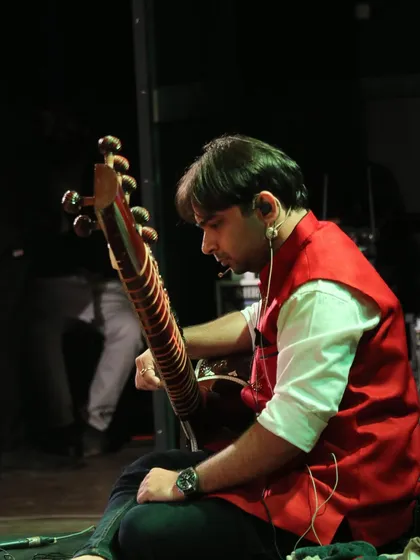 A side view from the stage, preparing to play. Whether on a big stage or in a small classroom, my goal is always to connect with the audience through the honest expression of music.
