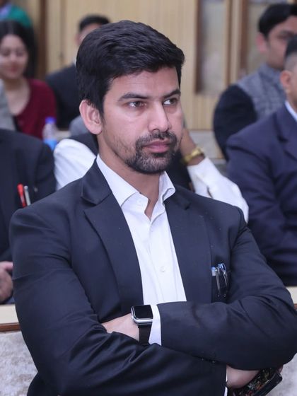 A candid shot while attending a book launch on Constitutional Law. Continuous learning is a cornerstone of my practice.