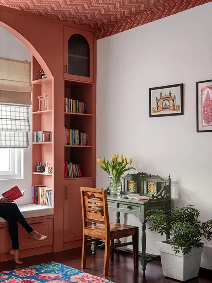 I believe every home needs a quiet corner for reflection. We created this cozy window seat and reading nook with custom-built shelving, turning an unused space into a personal haven for getting lost in a book.