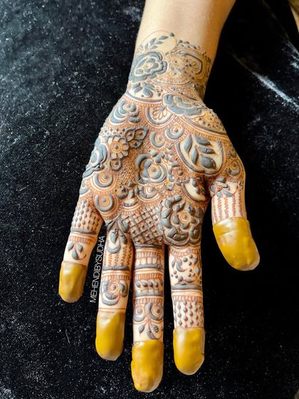 A single-hand design featuring a mix of floral and paisley motifs. This is a great option for someone who wants a beautiful but not overwhelming design.