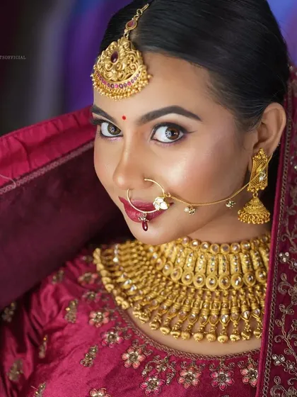 A smiling portrait of the model, looking radiant.