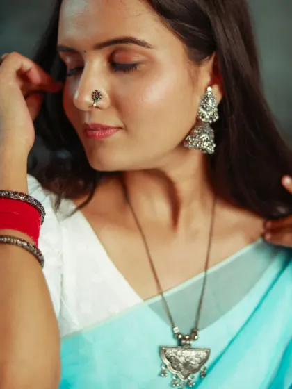 A close-up on the beautiful silver jhumkas and nose pin. I always make sure to capture the details that complete a traditional look.