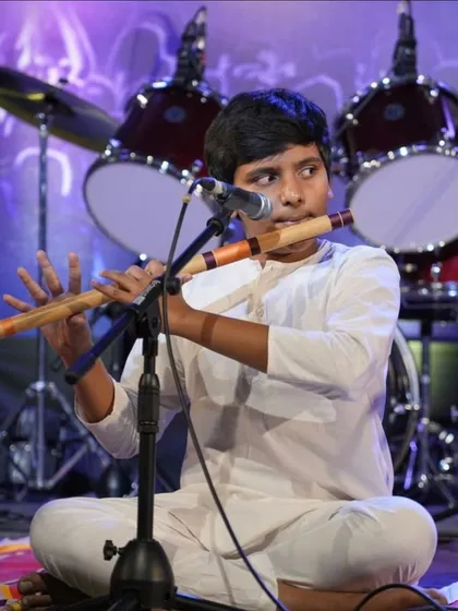 Student Sairam Shanmukh skillfully plays the bansuri during a classical composition at Kalaa Sangama.