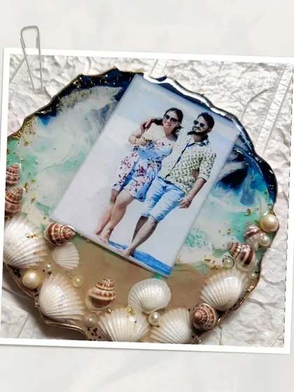 More views of the custom ocean themed photo frame. The layers of resin create a realistic wave effect, and the real seashells add a beautiful, tactile element to the piece.