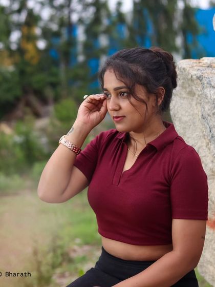 A candid-style outdoor shot that captures a natural, unposed moment. The soft background keeps the focus on the subject.