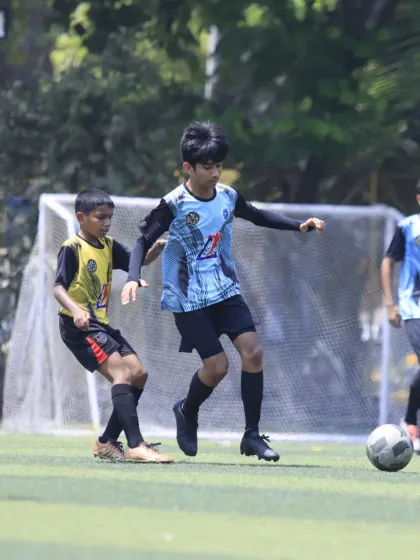 An intense moment of gameplay where our player is challenging an opponent for the ball, showcasing the competitive nature of our matches.