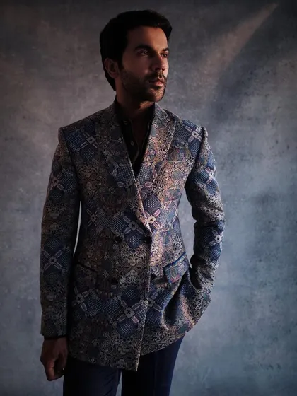 A closer look at the fully embroidered double-breasted suit by Anamika Khanna. The texture and pattern are incredible, making it a true couture menswear piece.