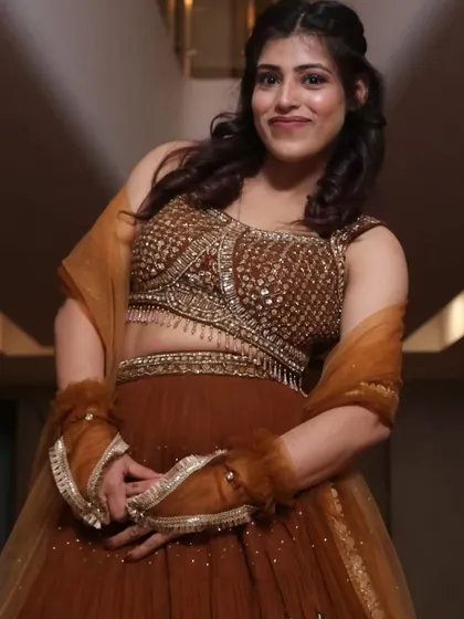 A close-up showing the details of my traditional outfit. I appreciate the artistry in fashion as much as the logic in law.