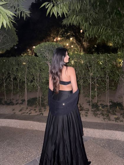 A back view of the chain top and skirt, showing how the modern top pairs with a traditional silhouette.