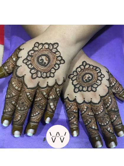 A design for Vat Savitri, featuring a cute elephant inside a circular mandala, surrounded by detailed finger work.