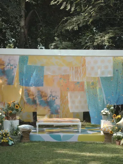 For a playful and artistic Haldi, I created this "Dhobi Ghat" theme. It features a backdrop of hand-dyed fabrics in shades of yellow and blue, complemented by fresh sunflowers for a truly unique celebration.