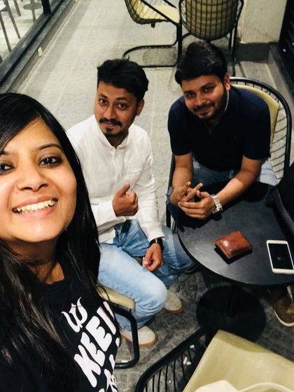 A photo with team members in Bangalore. This personal image adds a human touch to our professional journey and celebrates our collaborative spirit.