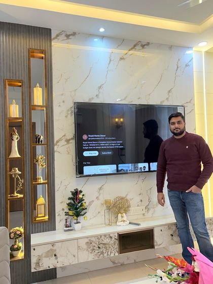 A proud shot with a newly completed TV unit, but in the background, you can see the open-plan kitchen, showing how the spaces connect.