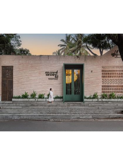 The full facade of Ishtaa, showcasing the balance between the solid brickwork and the perforated screens. This image captures the architectural presence of the restaurant and our commitment to creating inviting exteriors.