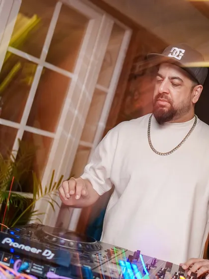 A motion blur shot of me at the decks, capturing the energy of the night.