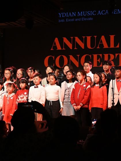 The entire cast of our Annual Concert on stage. This photo captures the scale of our event and the incredible community we've built.