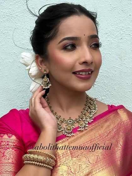 A beautiful portrait capturing the festive spirit. The makeup is glamorous yet traditional, perfect for celebrating Diwali.