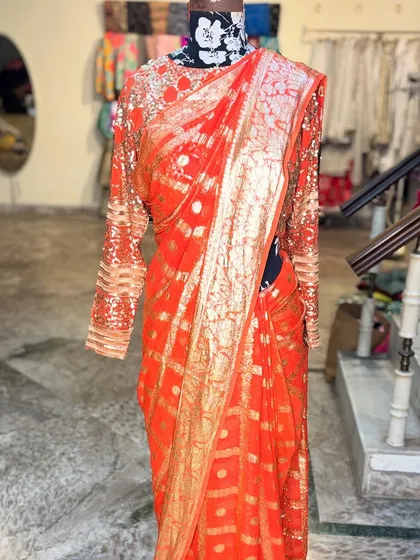 The complete look of the 'SONDARYA' saree on the mannequin, showcasing its elegant fall and rich texture. This is a limited edition piece, with only two designs created.
