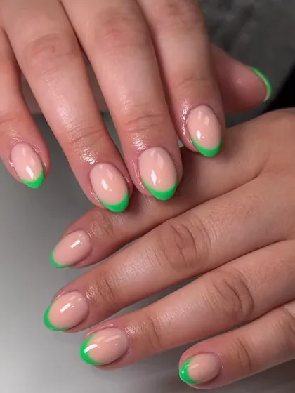 A fun and vibrant French manicure with neon green tips. This is a great way to incorporate bright colors into your look while keeping it chic.