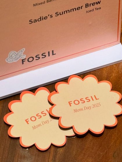 It's all in the details. For the Fossil Mother's Day event, we created custom-branded floral coasters and menus that tied the entire theme together, ensuring a cohesive and memorable brand experience for every guest.