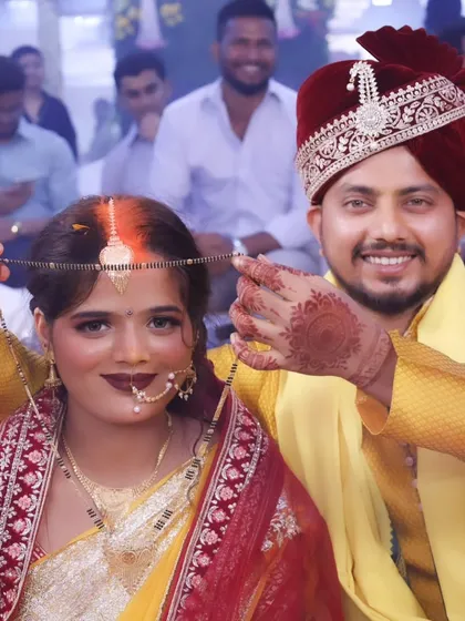 The mangalsutra ceremony, symbolizing the sacred union. The bride's glowing makeup and happy expression make this moment even more special.