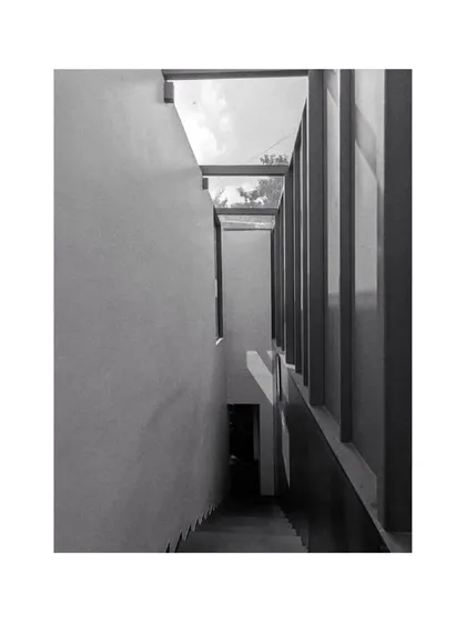 The staircase in our studio, where the simple geometry and play of light create a serene transition between floors.