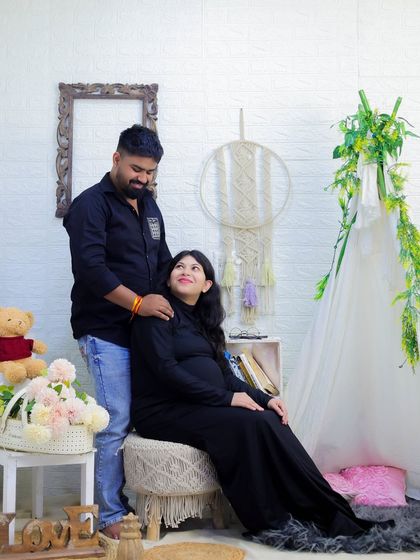 A relaxed and happy moment during a studio session. This couple shares a look of love amidst our boho-chic setup, complete with a teepee and macrame details.