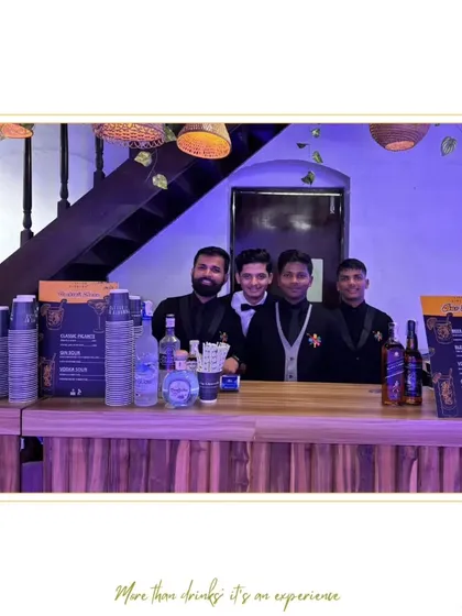 Our team of four bartenders ready to serve at an event. This photo showcases the manpower and coordinated effort we can provide to ensure smooth and efficient service for your guests.