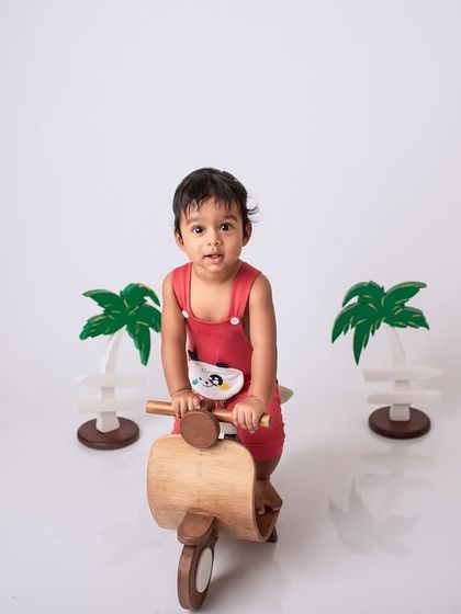 Ready for an adventure. This little one is all set with his wooden scooter in this fun and simple studio setup.