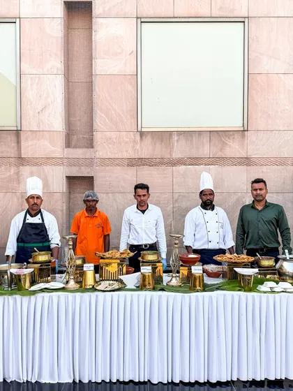 The team behind a beautiful buffet setup in Amritsar. Dressed in professional uniforms, they are the ones who ensure flawless service and hospitality at every event.