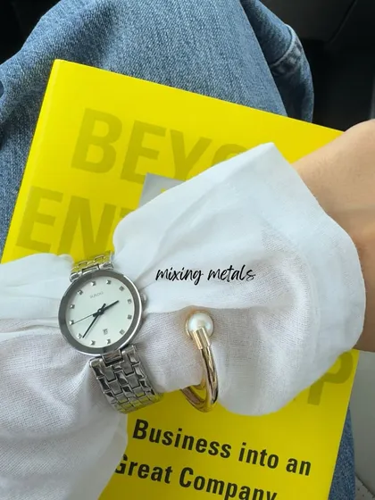 A small detail from my day: mixing metals. A silver watch with a gold and pearl bracelet is a chic way to show that style rules are meant to be broken. Accessories are all about personal expression.