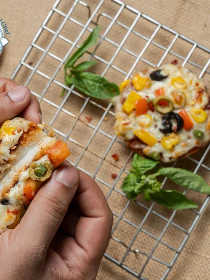 Mini pizzas with assorted vegetable toppings and gooey melted cheese, a fun and universally loved addition to any party menu.