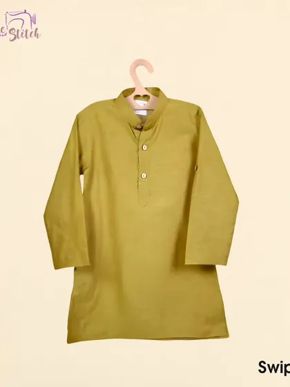 This simple, elegant mustard yellow kurta is a versatile piece for any boy's wardrobe. Made from soft cotton, it's perfect for celebrations or casual family gatherings.