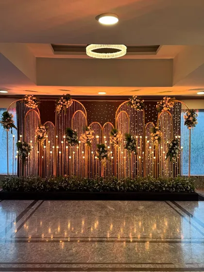 The photo booth backdrop under warmer lighting, creating a cozy and inviting glow for evening pictures.