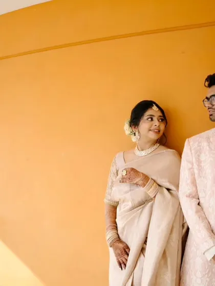 A minimalist and artistic portrait of the couple from their intimate 'Two-States' wedding, using clean lines and natural light.