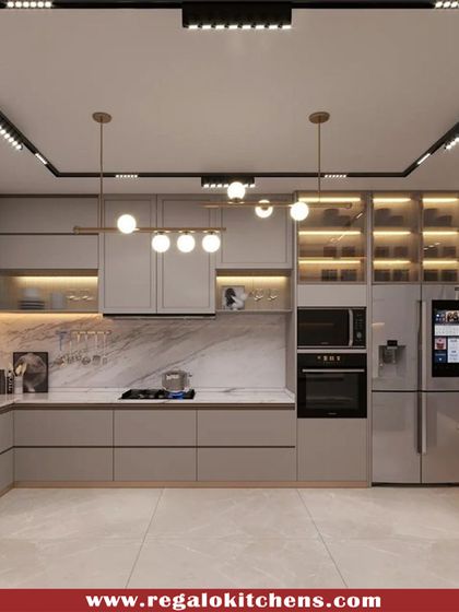 This modern kitchen showcases a fully integrated smart refrigerator with a screen. The light grey cabinets and track lighting create a bright, contemporary space, proving that high-tech can also be high-style.