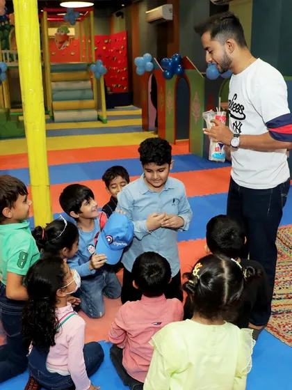An organized game in progress, keeping the children engaged and entertained during the Cinderella-themed celebration.