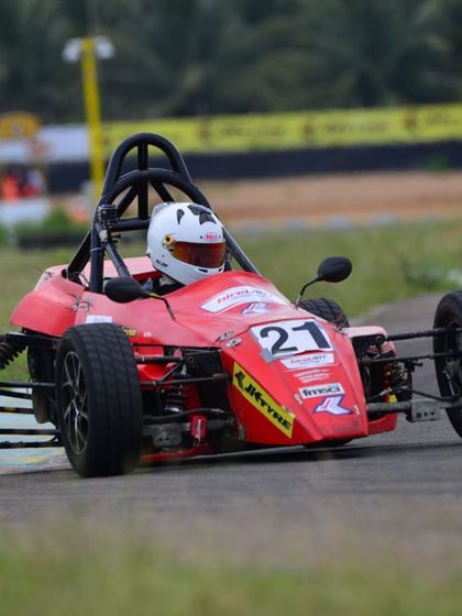Our driver in the number 21 car, cornering hard during a Formula LGB race, demonstrating the skills transferred from our karting program.