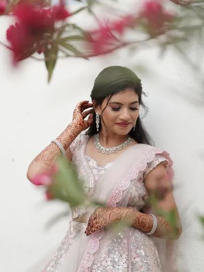 A beautifully framed shot of Nisarga, showing how her soft glam makeup and elegant hairstyle create a dreamy, ethereal look for her pre-wedding shoot.