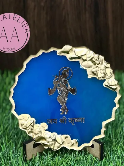 This 'Jai Shri Krishna' mantra frame in a vibrant blue with gold crystal accents is a beautiful addition to any sacred space.